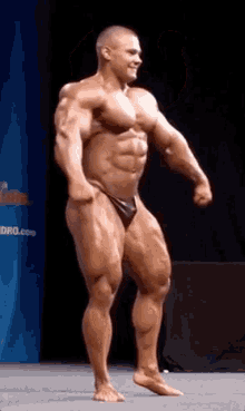 alexey lesukov bodybuilder posing