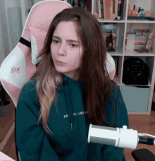 a girl wearing a hoodie that says " pro duuneye "