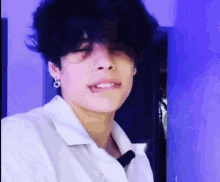 a close up of a person with a piercing in their mouth .
