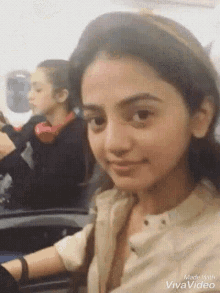 a girl is sitting on an airplane and the video was made with vivavideo software