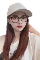 a woman wearing glasses and a white hat looks at the camera