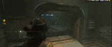 a screenshot of a video game shows a man walking through a dark tunnel