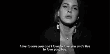 a black and white photo of a woman wearing a necklace and earrings and a quote .