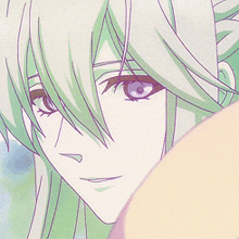 a close up of a person 's face with green hair and blue eyes