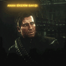 a man in a black jacket stands in front of a sign that says " anana sikerim bakişi "