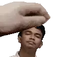 a hand is holding a man 's head in a pixel art .