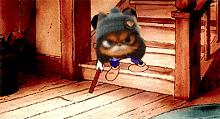 a cartoon cat wearing a beanie is standing on a wooden floor next to stairs .