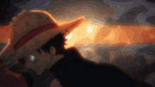 a man wearing a straw hat with a red ribbon around his waist