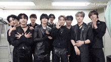 a group of young men are posing for a picture with the words & team episode visible behind them