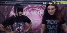 a woman wearing a black shirt that says tof gai jin