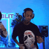 a man wearing headphones and a shirt that says mafia mid