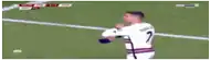 a soccer player wearing a white jersey with the number 7 on it .