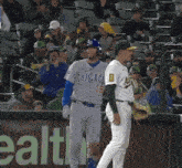 a baseball player wearing a chicago jersey is talking to another player