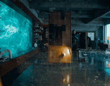 a man stands in a room with a large screen behind him that says ' kepler '
