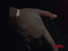 a close up of a person 's hand with the words blood brothers canada on the bottom right