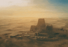 a large building in the middle of the desert