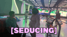 a bowling alley with the words seducing in pink