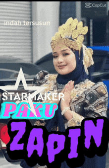 a woman wearing a hijab and a star maker costume stands in front of a blue truck