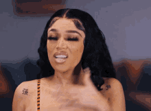 a woman has a tattoo on her arm that says 3