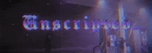 the word unscripted is written in purple letters on a purple background .