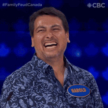 a man with a name tag that says harold laughs