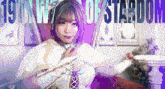 a woman in a white cape with the words 19th world of stardom behind her