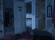 a girl in a pink tutu is jumping in the air in a bedroom