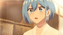 a girl with blue hair and a white shirt