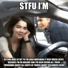 a man and a woman are sitting in a car with the caption stfu i m