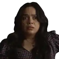 a woman wearing a plaid shirt and a necklace looks surprised