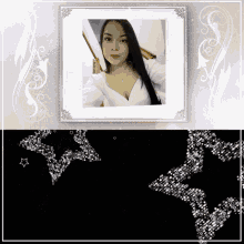 a picture of a woman in a white top is in a white frame