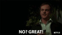 a man holding a cup says no great