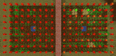 an aerial view of a garden with a brick wall
