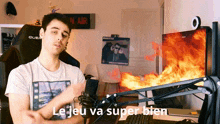 a man standing in front of a microphone with the words le jeu va super bien written on the bottom