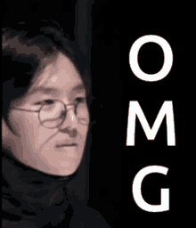 a close up of a person wearing glasses with the word omg written below them