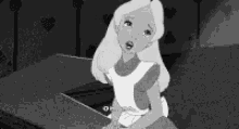 a black and white photo of alice from alice in wonderland crying .