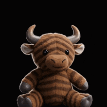 a stuffed animal with lightning coming out of its horns is sitting in front of a sign that says yuge