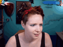 a woman wearing a red headband with a bow on it