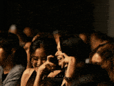a group of women are sitting in a dark room with the words film tice written on the bottom