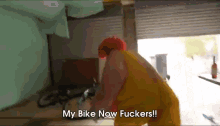 a clown says " my bike now fuckers " while standing in a garage