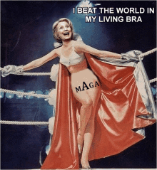 a woman in a boxing ring is wearing a red cape that says maga