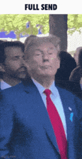 a man in a blue suit and red tie with the words full send below him