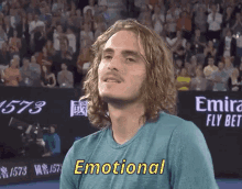a man in a blue shirt with the word emotional on it