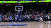 a basketball game is being played in front of a crowd with ads for mtn dew and tissot