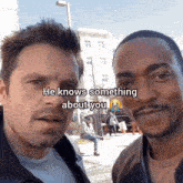 two men are posing for a picture and one of them says " he knows something about you "