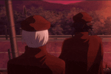 a couple of people standing next to each other with one wearing a red cape
