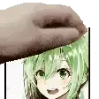 a hand is touching the head of a girl with green hair .