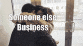 a man is hugging a woman with the words someone else business written on the bottom