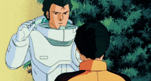 a man in a white suit stands next to another man in a yellow jacket