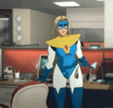 a woman in a blue and white superhero costume stands in an office
